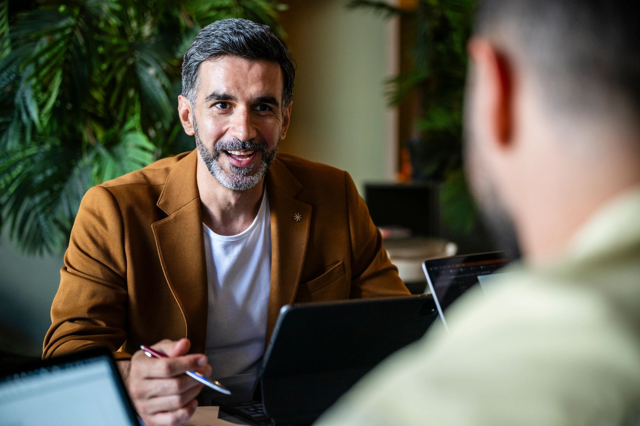 Two professionals in a consultation meeting discussing training needs