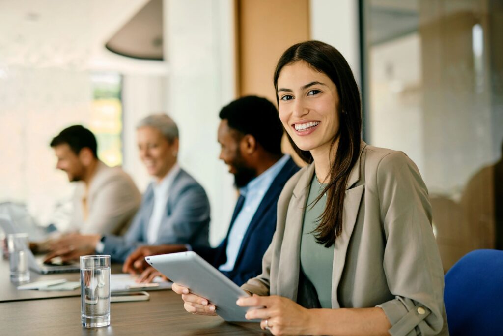 Young businesswoman smiling during a meeting with her colleagues